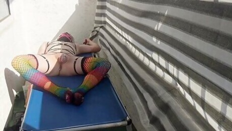 Caged Sissy Plays With Her Dildo On Public Balcony