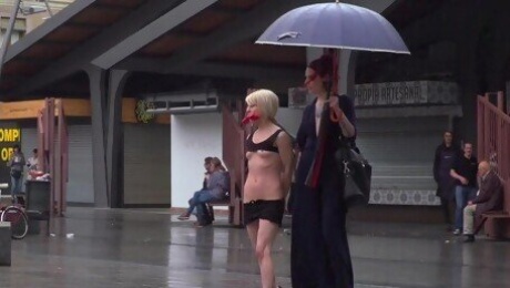 Kinky Silvia Rubi humiliates exposed sub Nora Barcelona in public