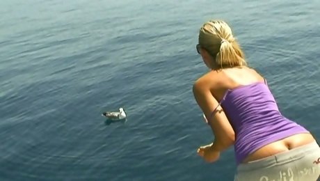 Obedient housewife Sandy takes a sun bath on the boat topless