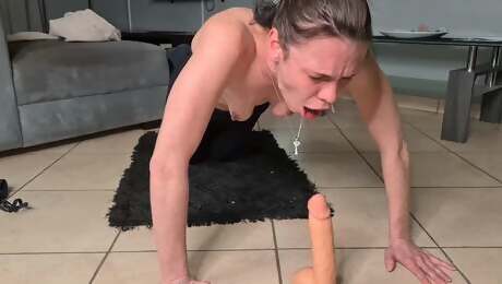 Slut-deep-throat gags herself with a dildo.